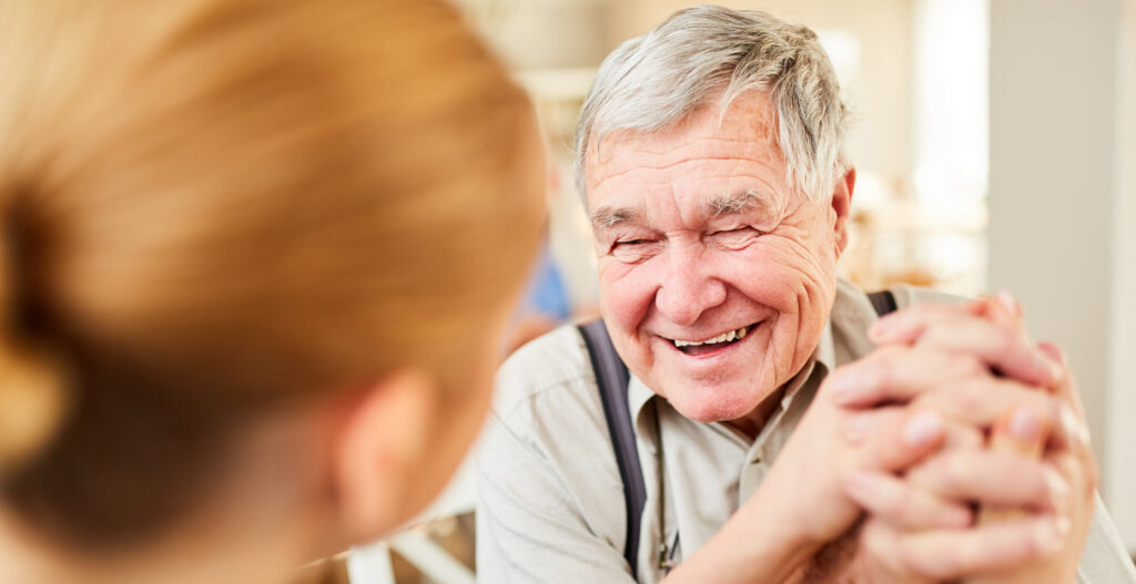 Old man gets hope and is happy with care provider